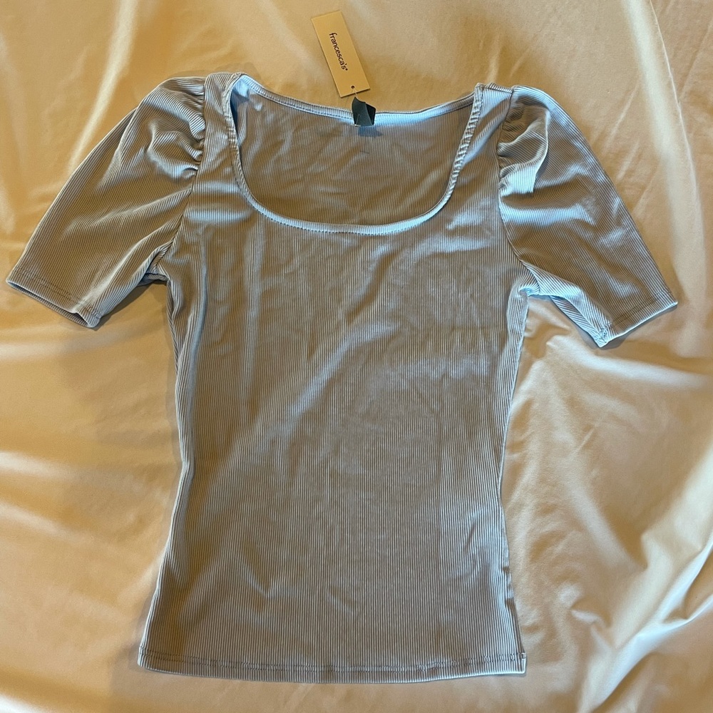 Blue scoop neck top with puff sleeves.